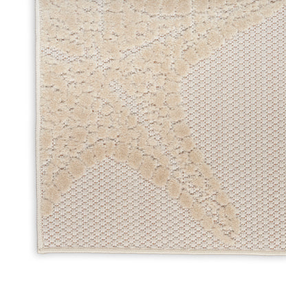 Beige textured rug with raised floral lattice pattern and woven mesh section for cozy living room decor.
