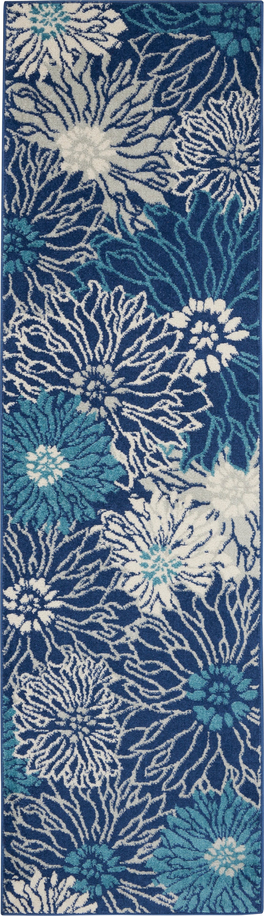 Deep blue hallway runner rug with oversized white and teal floral pattern, tufted texture, ideal for entryways.