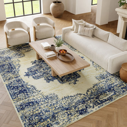 Blue & yellow patterned rug in a bright living room with large windows.