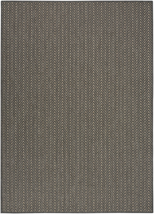 Dark blue-gray woven rug with tan chevron pattern, zigzag rows, rectangular, textured weave.