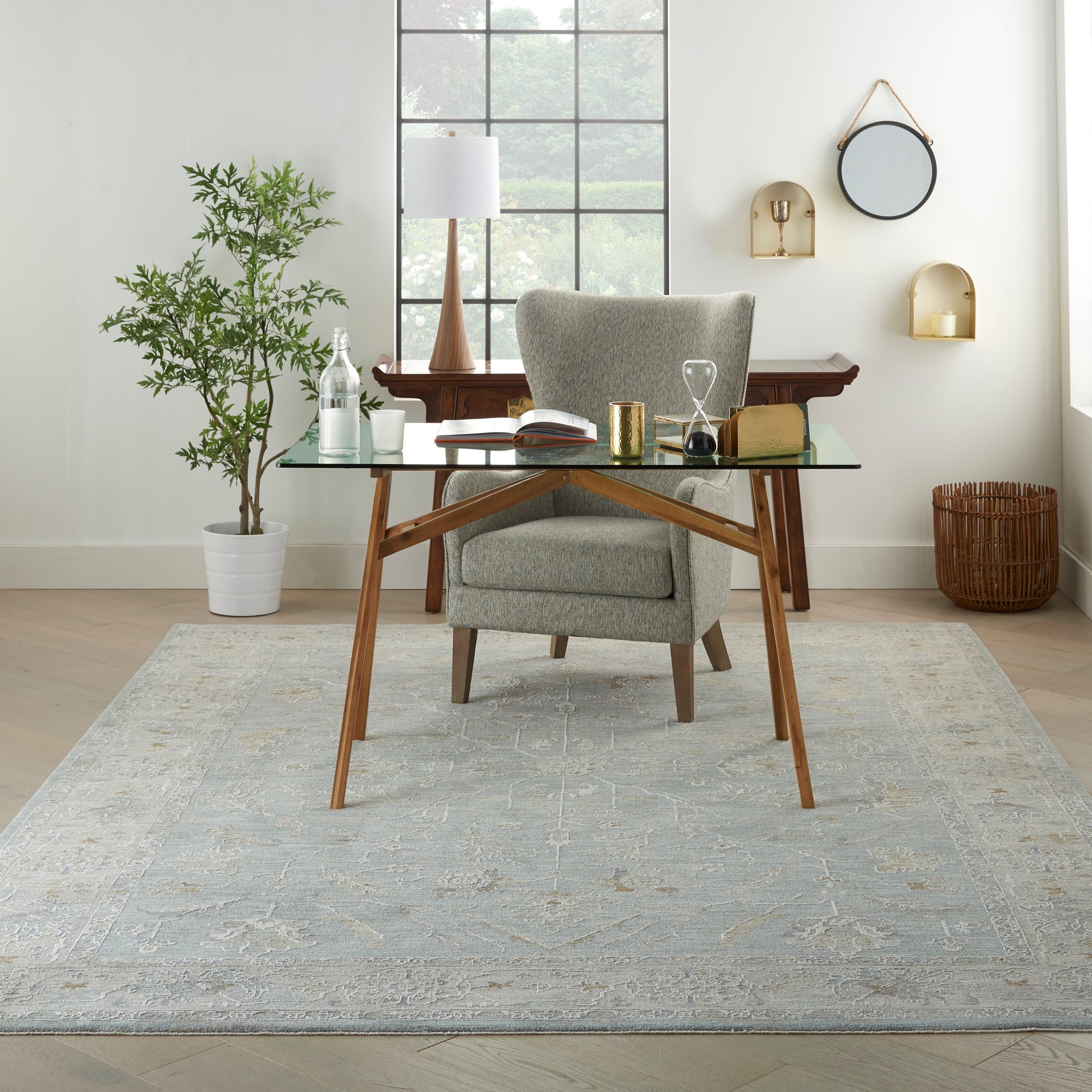 Vintage 8' x 10' rug in a bright room with a plant nearby.