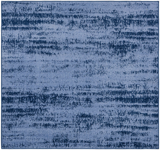 Blue abstract area rug with distressed, brushstroke pattern in dark navy tones; rectangular, plush, modern decor.