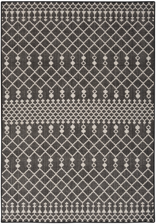 Dark charcoal and ivory geometric rug with diamond lattice pattern and decorative striped borders.