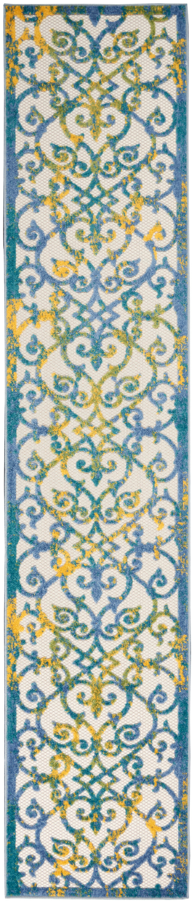 Tall runner rug with teal border & white field, blue & yellow ornate scrolling pattern.