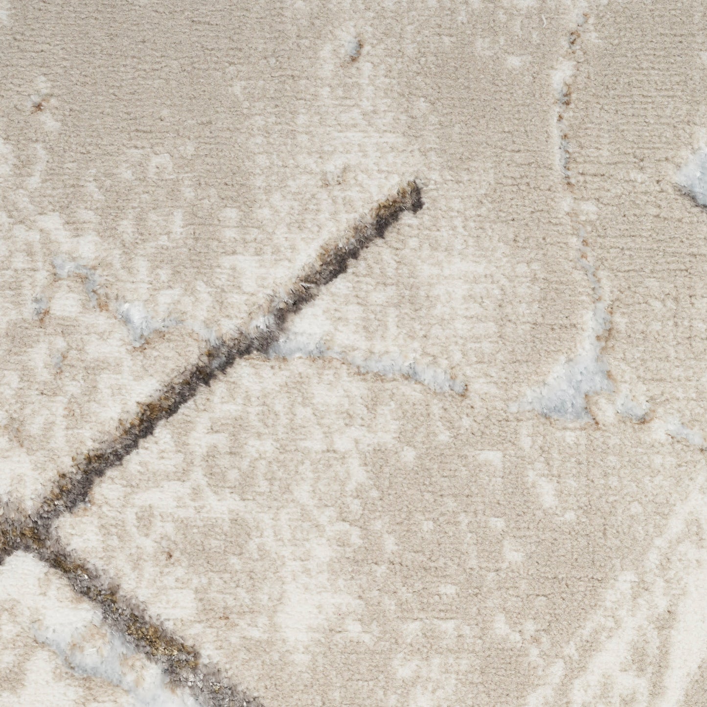 Beige textured rug close-up with dark brown diagonal chevron stripe.