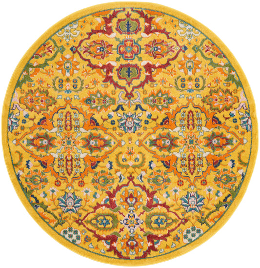 Round yellow rug with vibrant multicolor floral motif and ornate border; decorative Oriental-style floor covering.