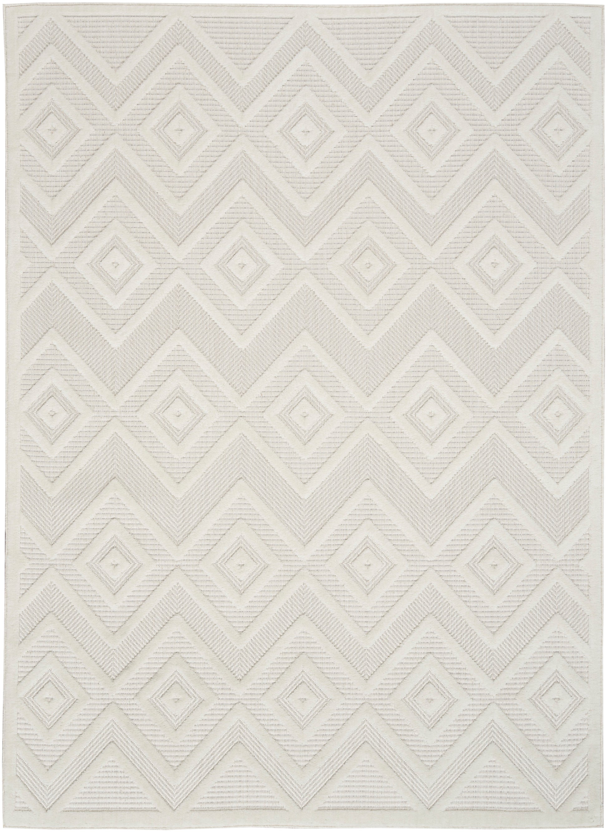 Cream geometric rug with raised diamond and chevron pattern, woven texture, rectangular.