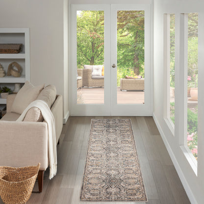 Neutral living room with cream sofa, throw, built-in shelf, runner rug, wood floor, and French doors to a wicker patio.