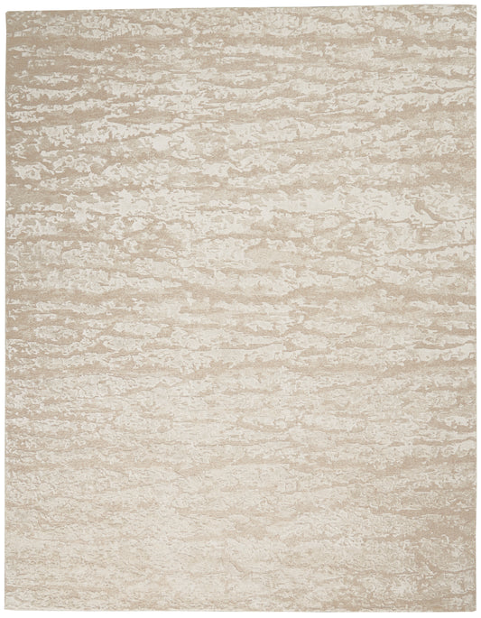 Beige textured area rug with subtle marbled pattern in cream and taupe tones.