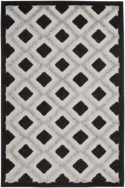 Geometric area rug with repeating diamond lattice in light gray and black, with a solid black border.