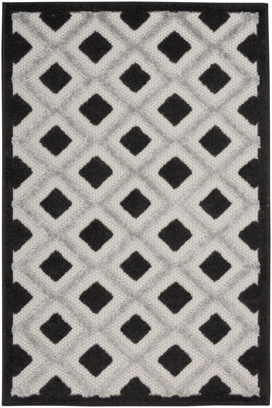 Geometric area rug with repeating diamond lattice in light gray and black, with a solid black border.