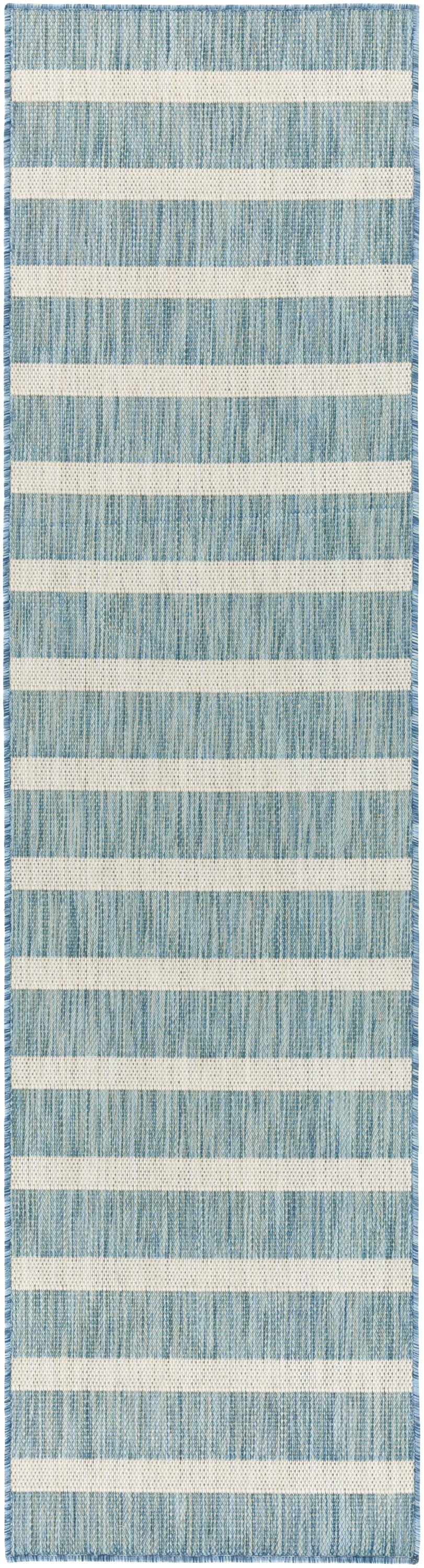 Woven blue and cream rug runner with alternating textured blue bands and ivory stripes; flat-weave with fringe edges.