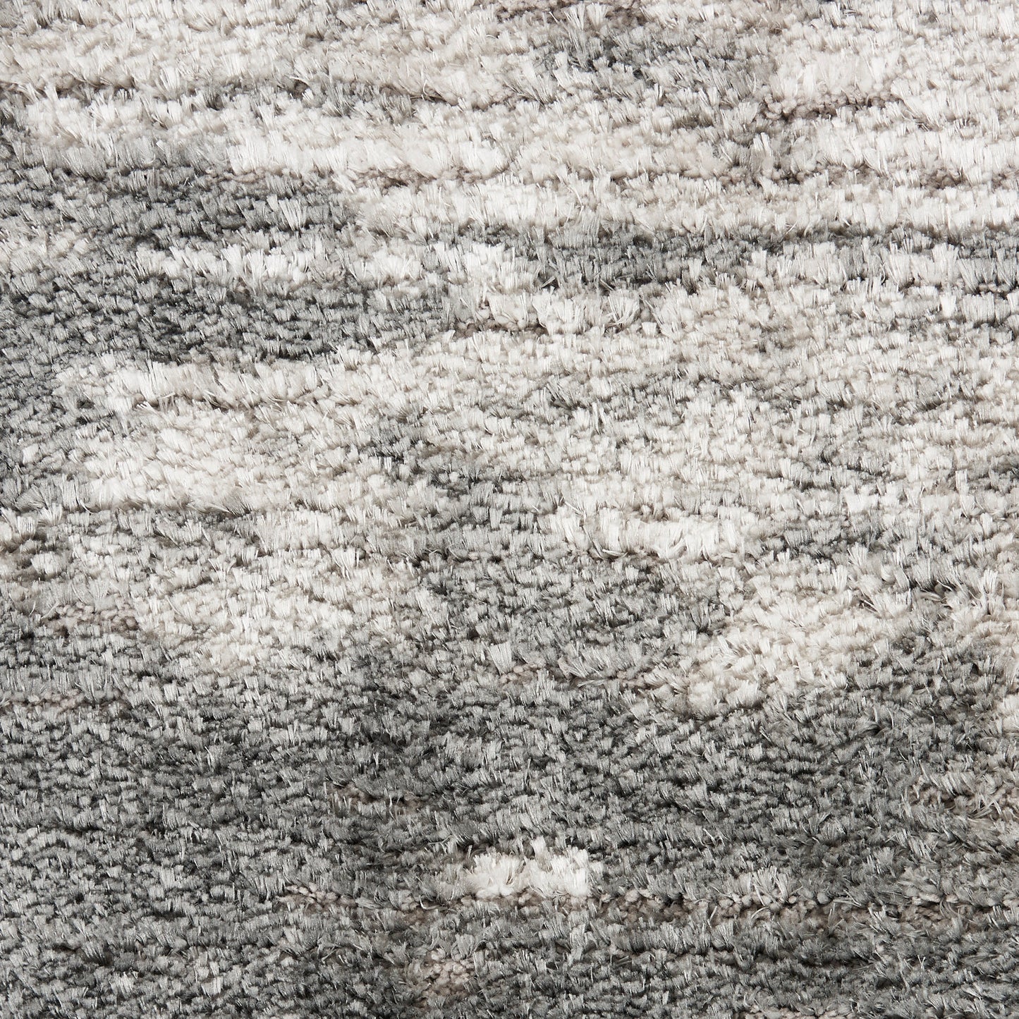 Shaggy grey and ivory rug with plush, textured pile; modern rectangular area rug.