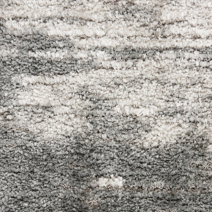 Shaggy grey and ivory rug with plush, textured pile; modern rectangular area rug.