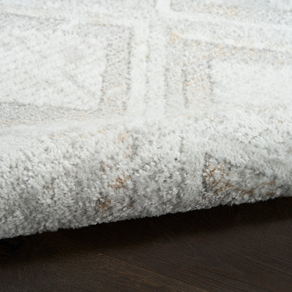 Cream rug with a subtle geometric pattern on a dark wood floor, 8' x 10'.