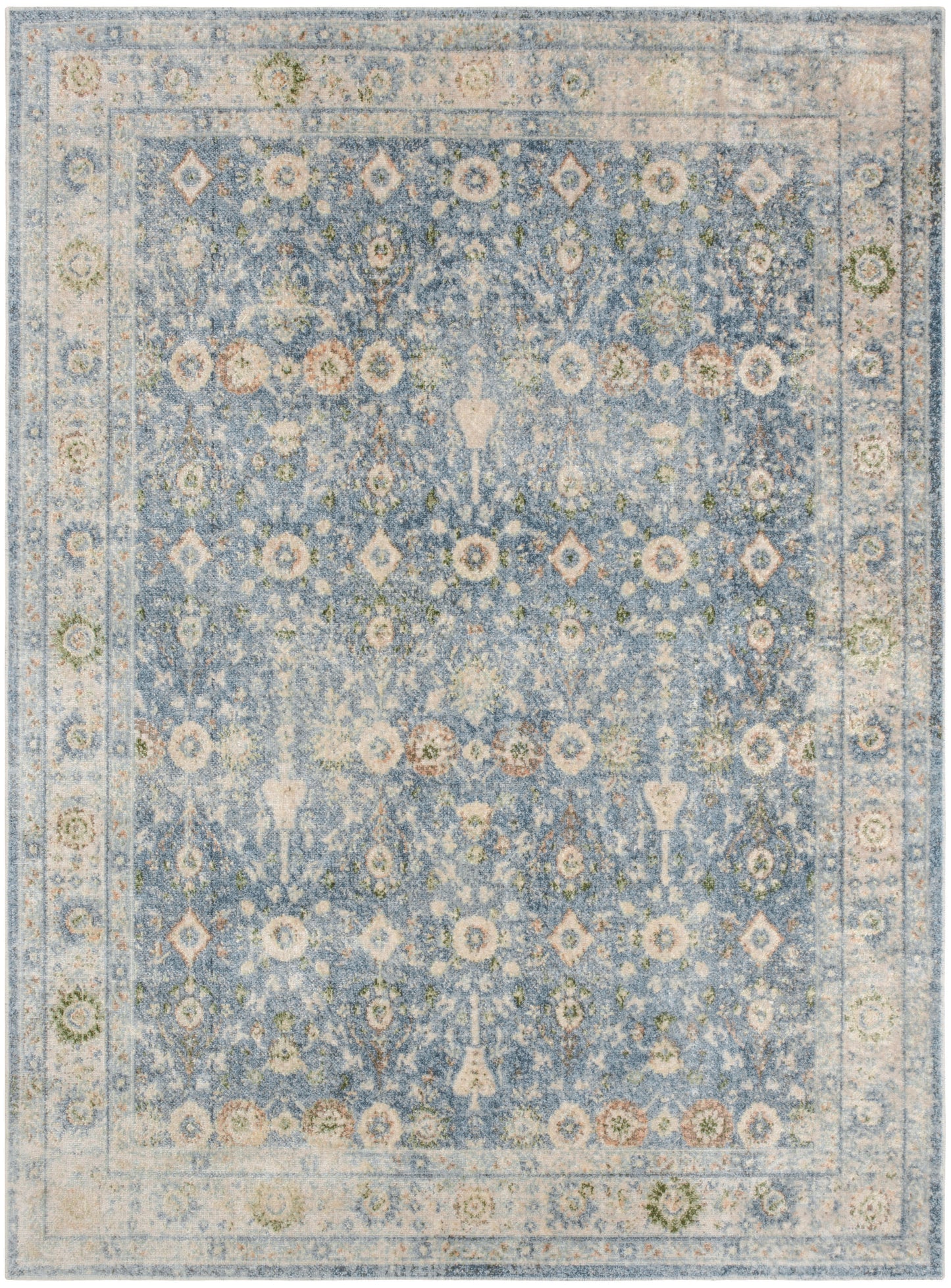 Rectangular distressed blue oriental rug with ivory border and floral medallion pattern; vintage look for living room decor