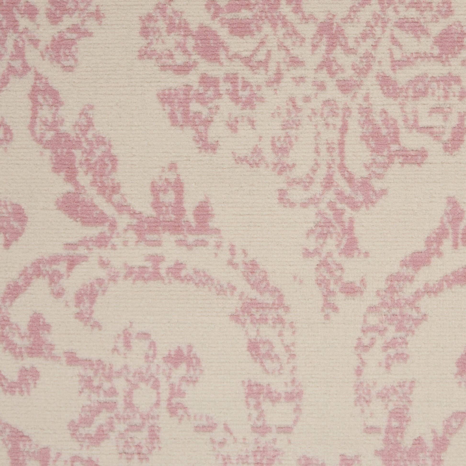 Beige rug with pink damask floral pattern; jacquard-style weave.