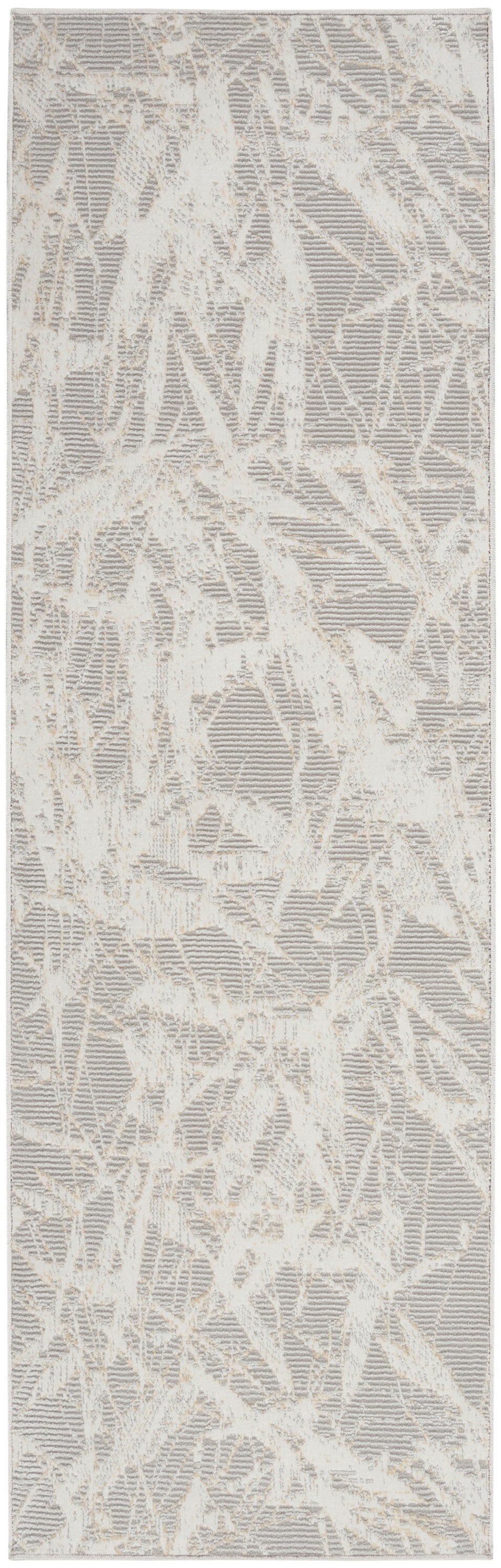 Rectangular area rug in cream and taupe with abstract branch-like pattern and soft textured pile.