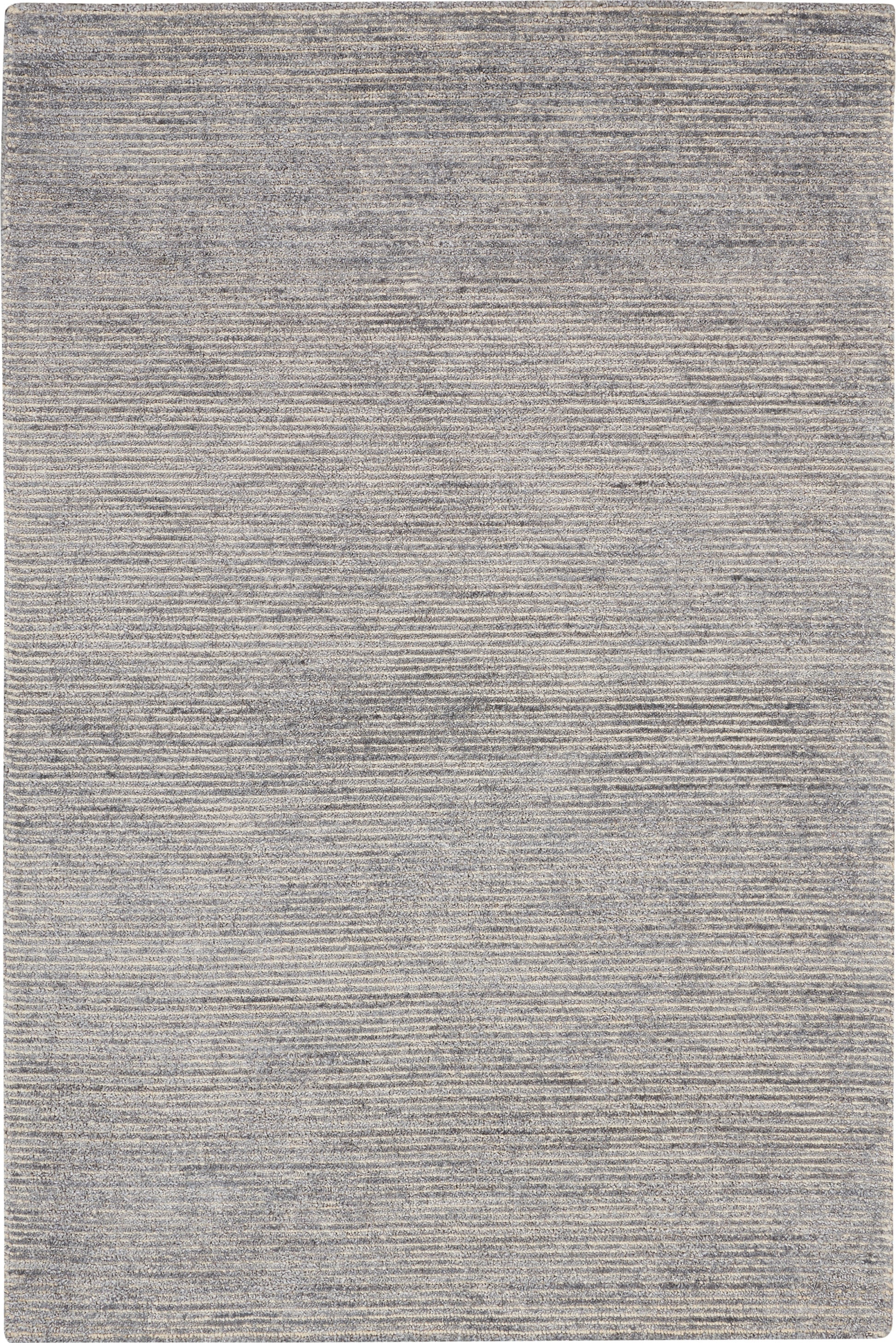 Light grey rectangular area rug with fine horizontal ribbed texture; modern, neutral home decor.