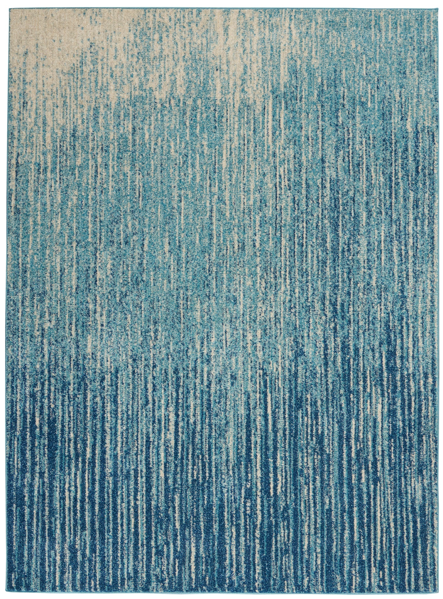 Blue gradient rug with vertical teal to navy streaks and a textured woven finish.