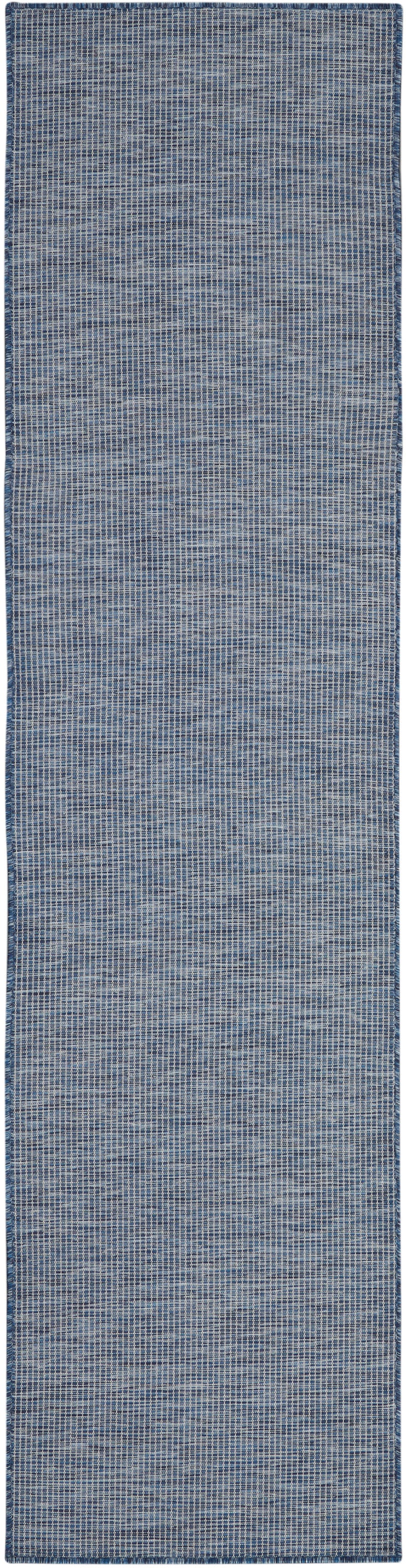 Blue woven hallway runner rug with subtle grid pattern and textured denim tones; cotton blend.