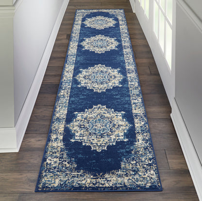 Navy blue hallway runner rug featuring large ivory medallion motifs and a light distressed border.