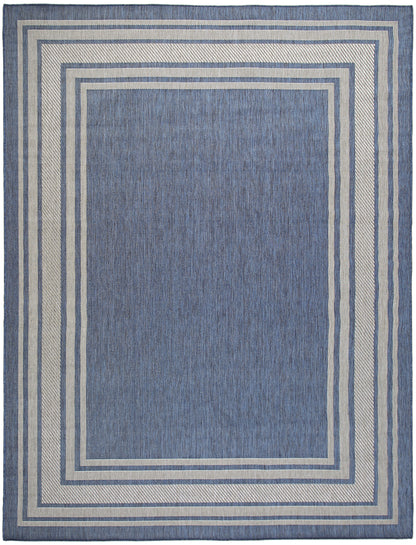 Blue area rug with nested cream and blue borders forming concentric rectangles; woven texture, rectangular shape.