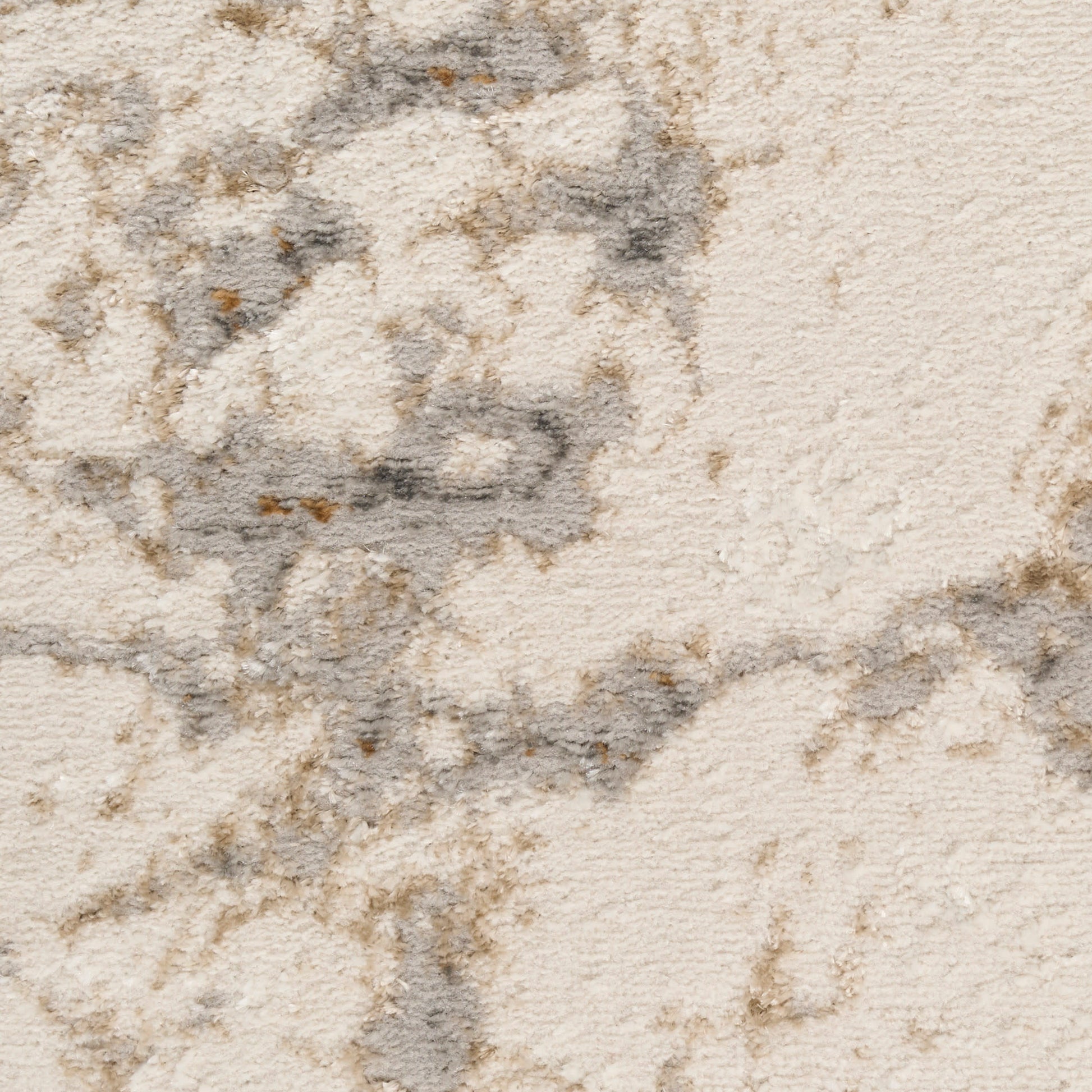 Cream-beige plush rug with textured pile and gray marbled pattern.