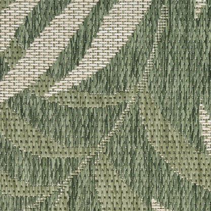 Close-up of olive-green and khaki geometric woven rug with a textured chevron pattern, 8' runner.