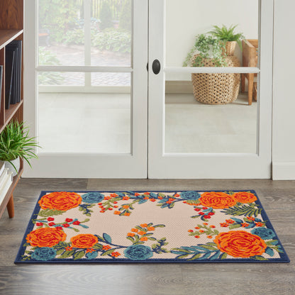Rectangular floral doormat with orange roses, blue blooms, green leaves and a dark blue border for entryways.