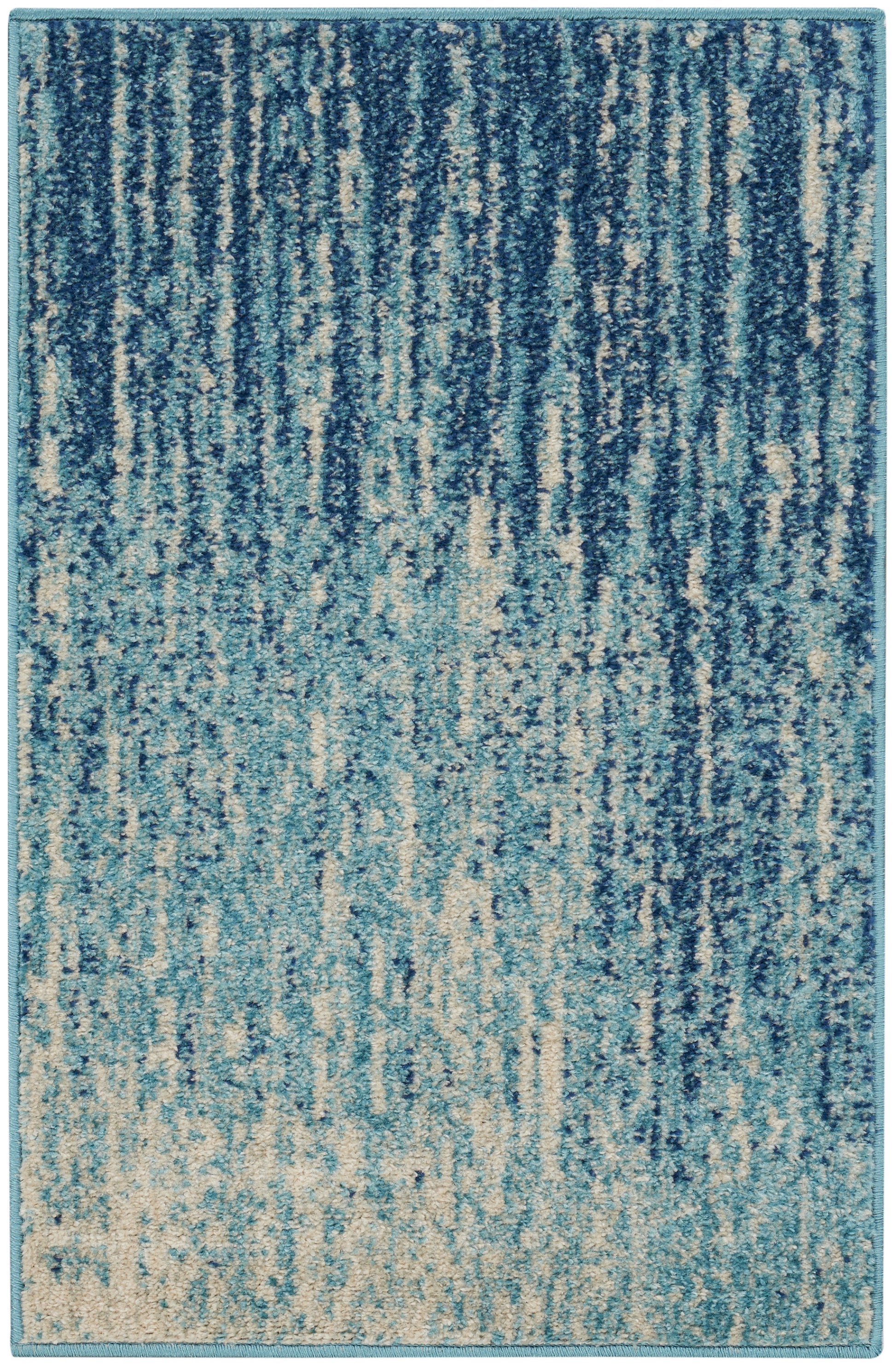 Blue abstract area rug with turquoise border; gradient vertical streaks from navy to aqua, plush textured.