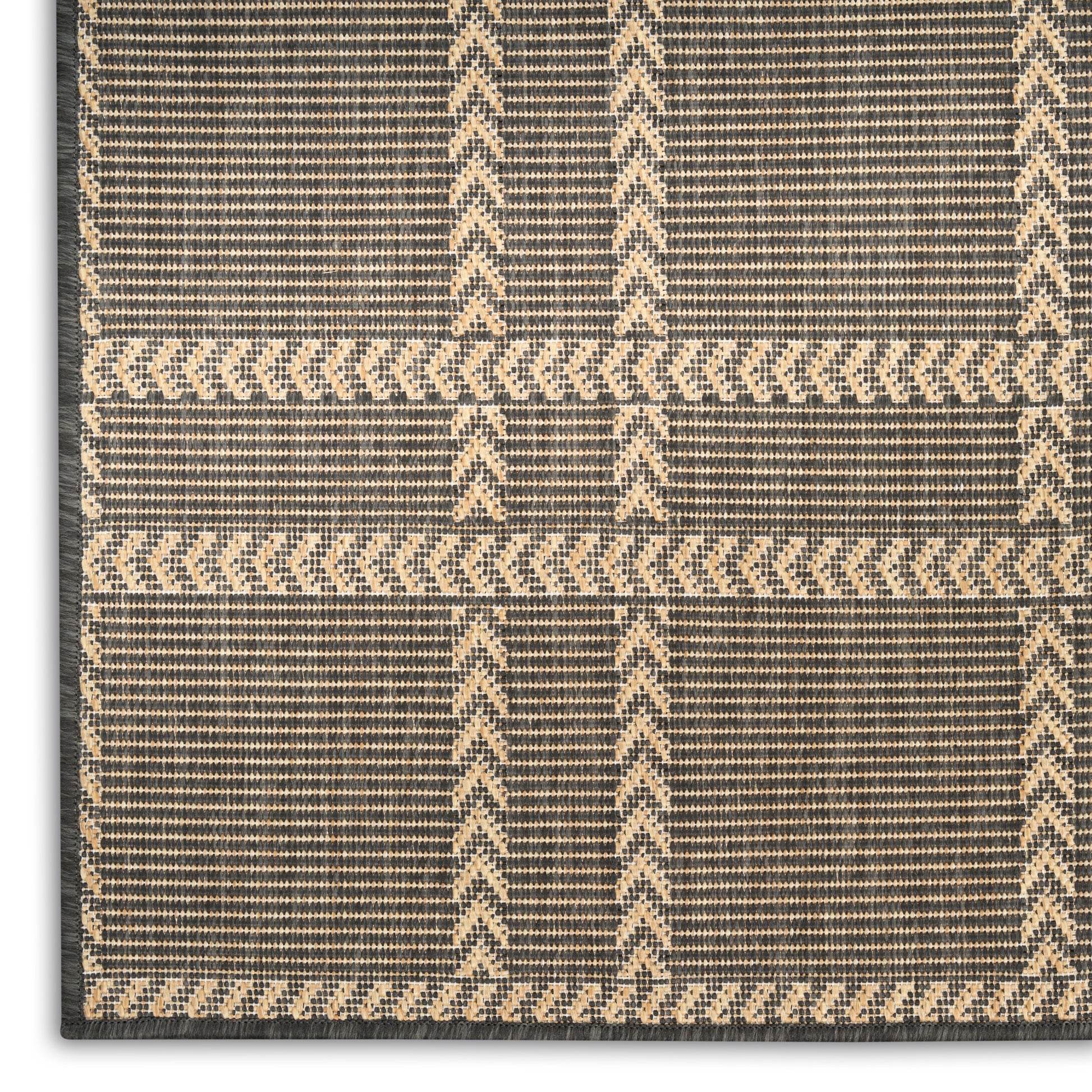 Beige and charcoal woven rug with plaid chevron panels and natural fiber texture.