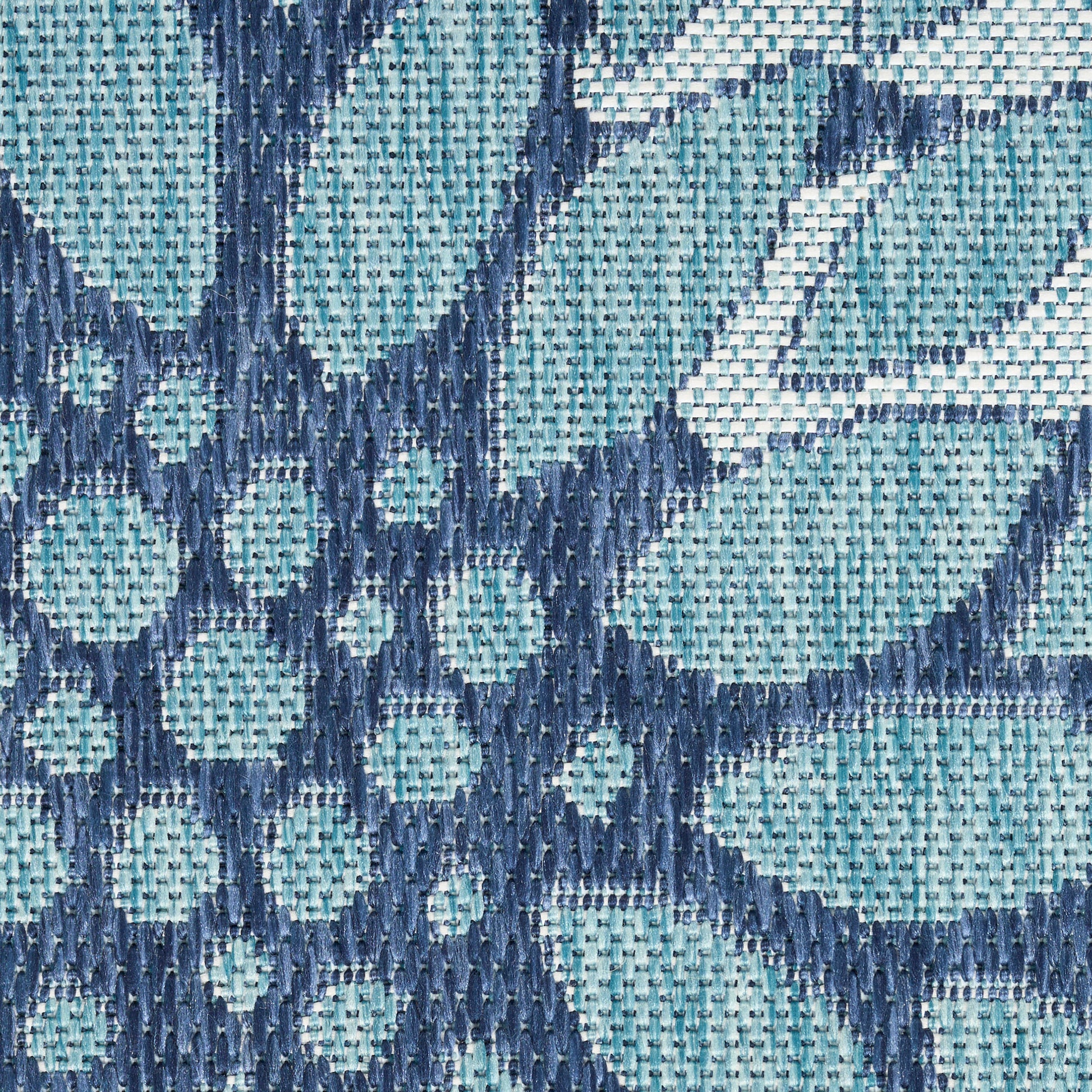 Teal and navy woven fabric with geometric diamond pattern; jacquard-style textile texture for upholstery.