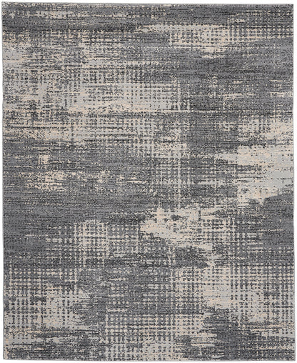 Rectangular abstract area rug in gray and beige with distressed pattern for modern interiors.