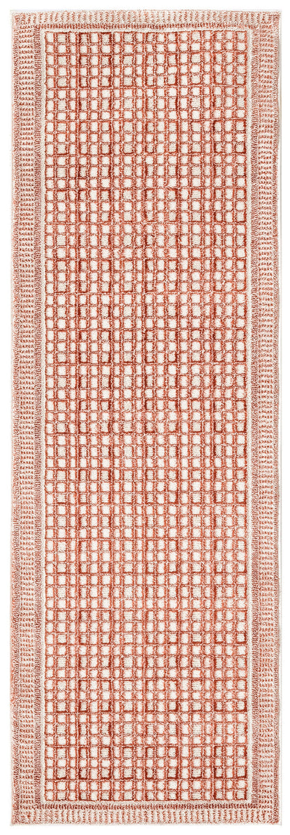 Coral-pink rectangular rug runner with a dense square-grid pattern and bordered edge.