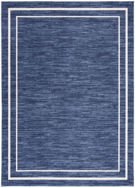 Blue textured outdoor rug with double white border frames along the edges, modern home decor.