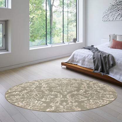 Round 8' beige area rug with subtle damask pattern in a bright modern bedroom beside a low wooden platform bed.