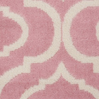 Pink runner rug with white Moroccan trellis pattern; soft textured fabric for stylish home decor.