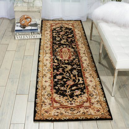 Long oriental runner rug with black center, red medallion, and beige-gold floral border; decorative floor runner.