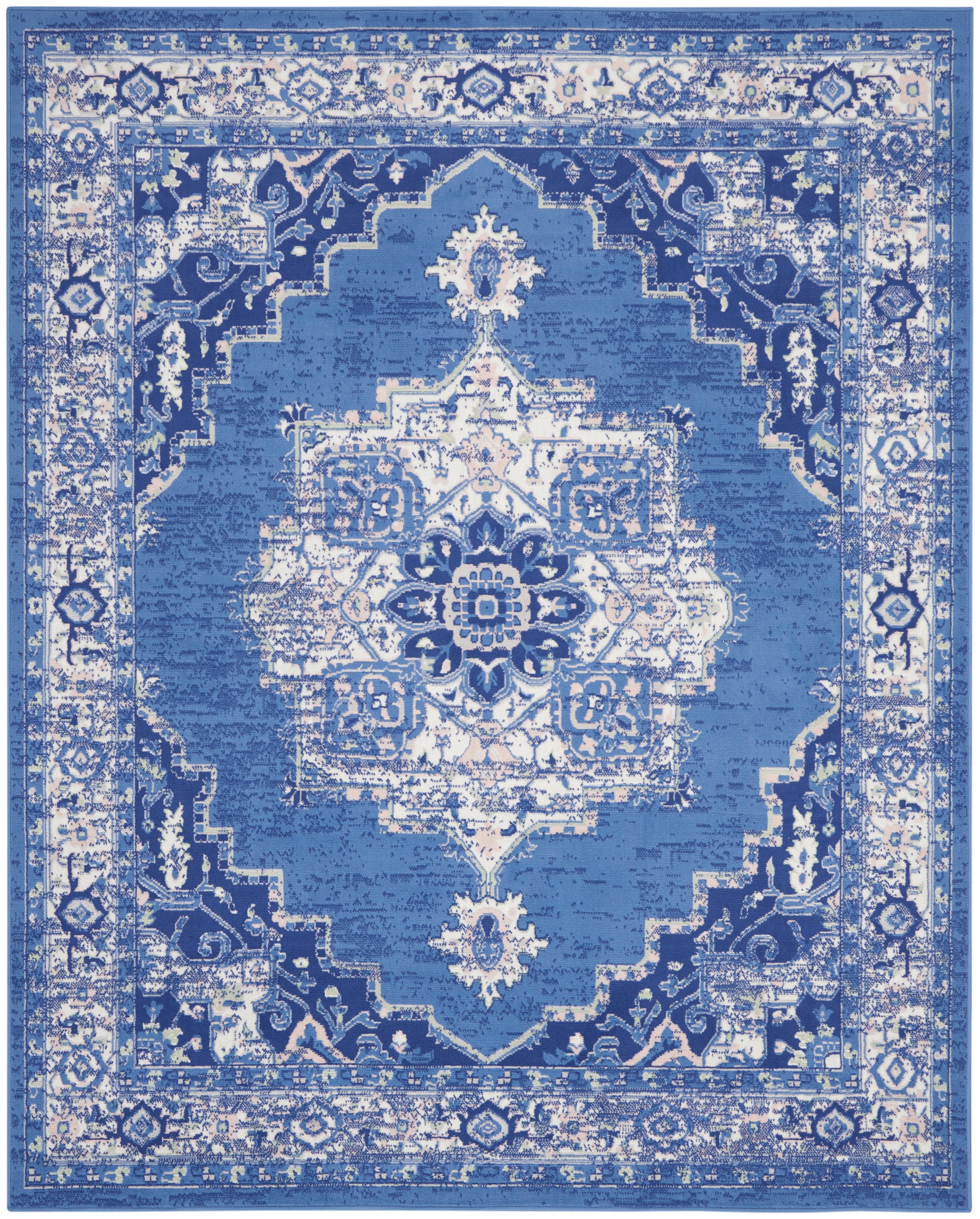 Blue oriental rug with white distressed medallion center and ornate border; rectangular Persian-style area rug.