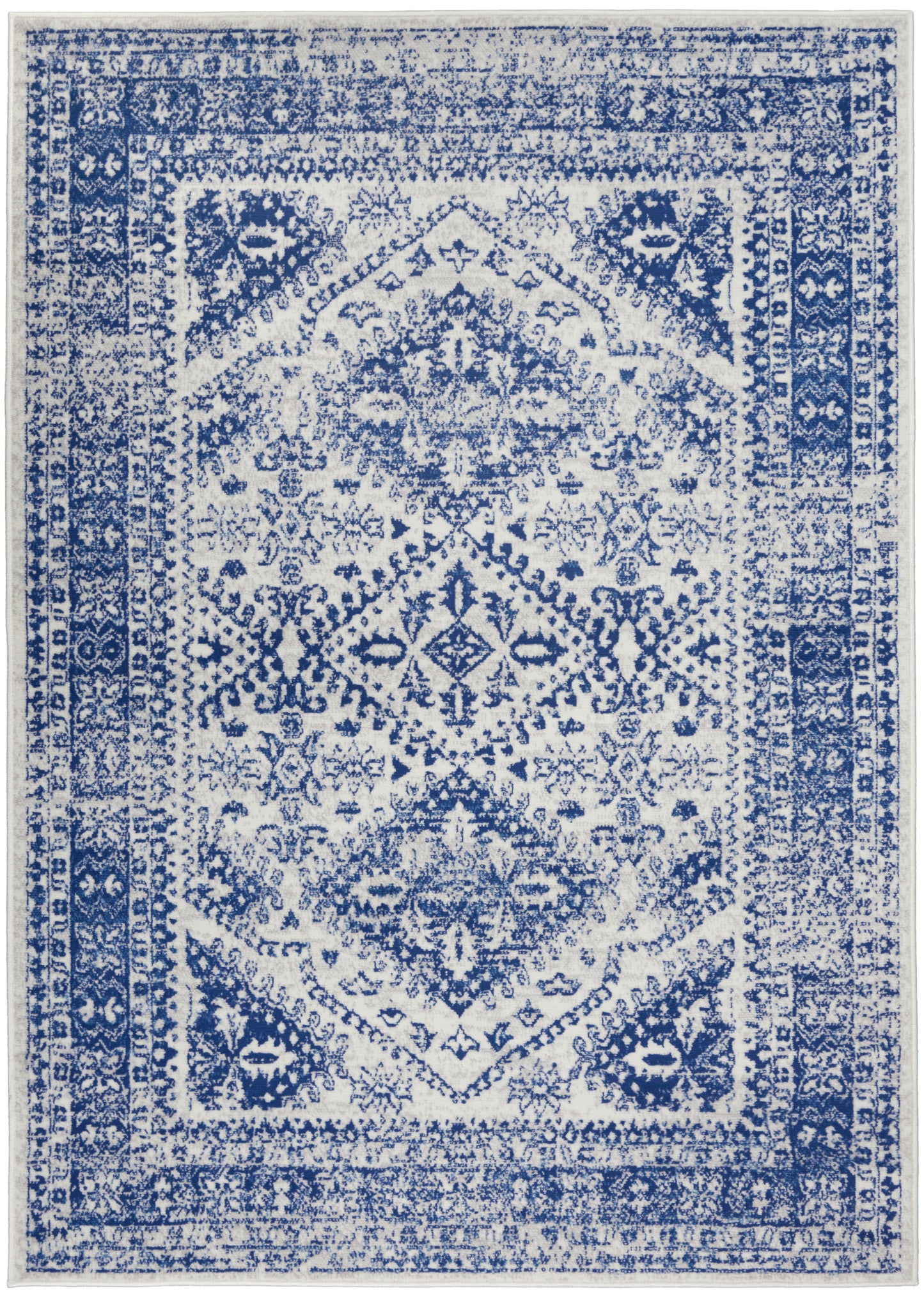 Rectangular blue-and-white distressed oriental area rug with central medallion and ornate border.