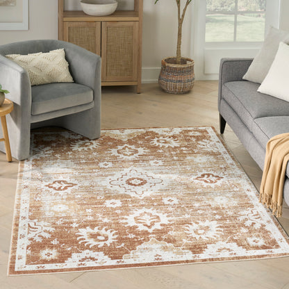 Moroccan-inspired rectangular living room rug in cream & warm tan with distressed floral motif & beige border