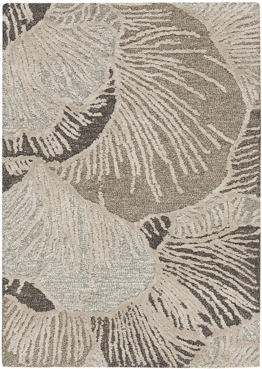 Neutral-toned woven rectangular rug with large abstract botanical leaf pattern in cream and taupe.
