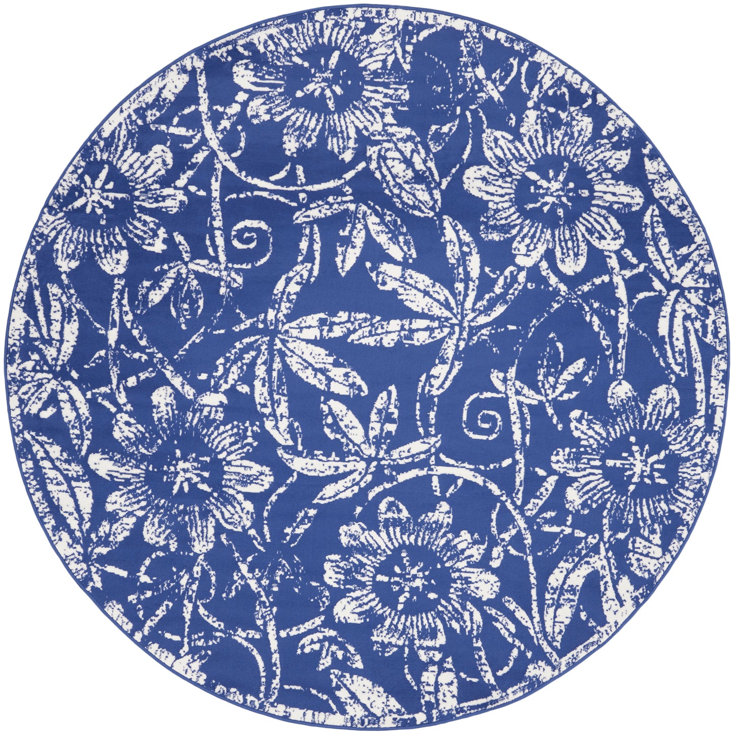 Round blue rug with a white floral pattern and a central pale blue rectangle overlay.