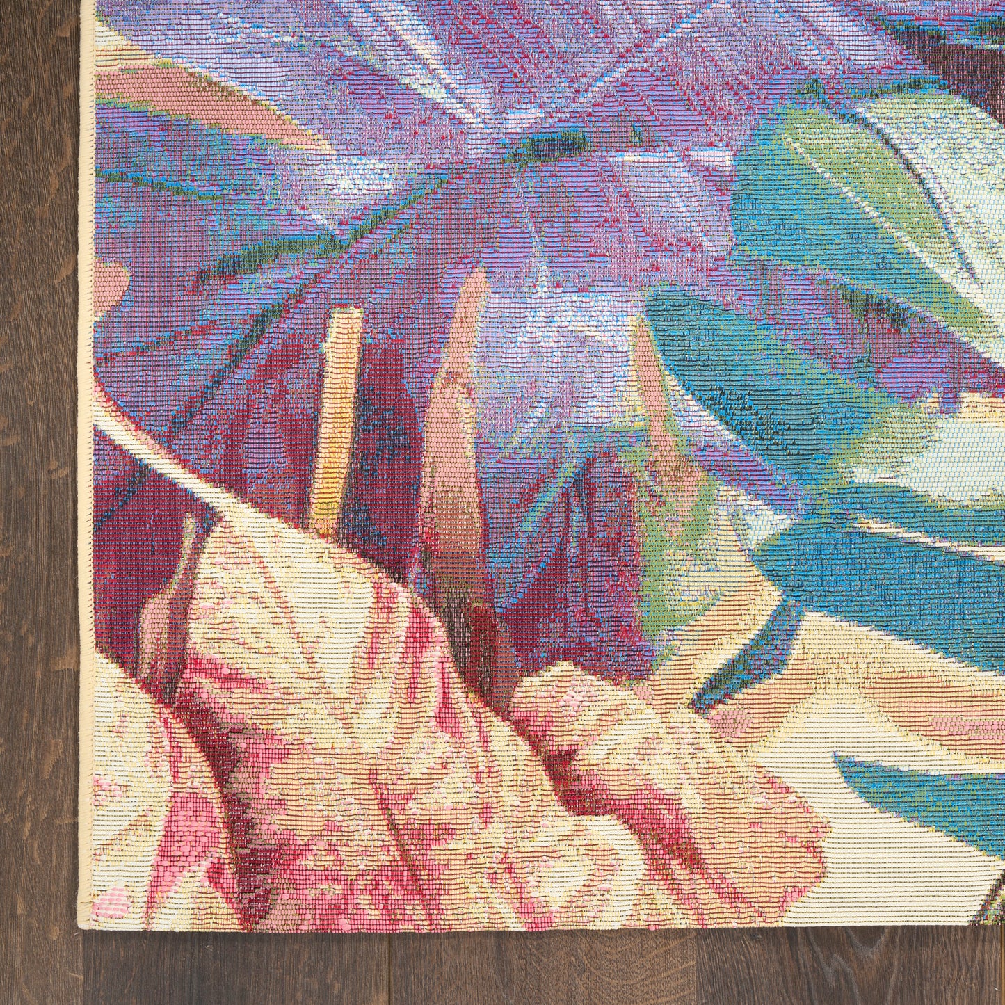 Cotton woven wall tapestry with oversized pink, purple and teal tropical leaves on a cream background.
