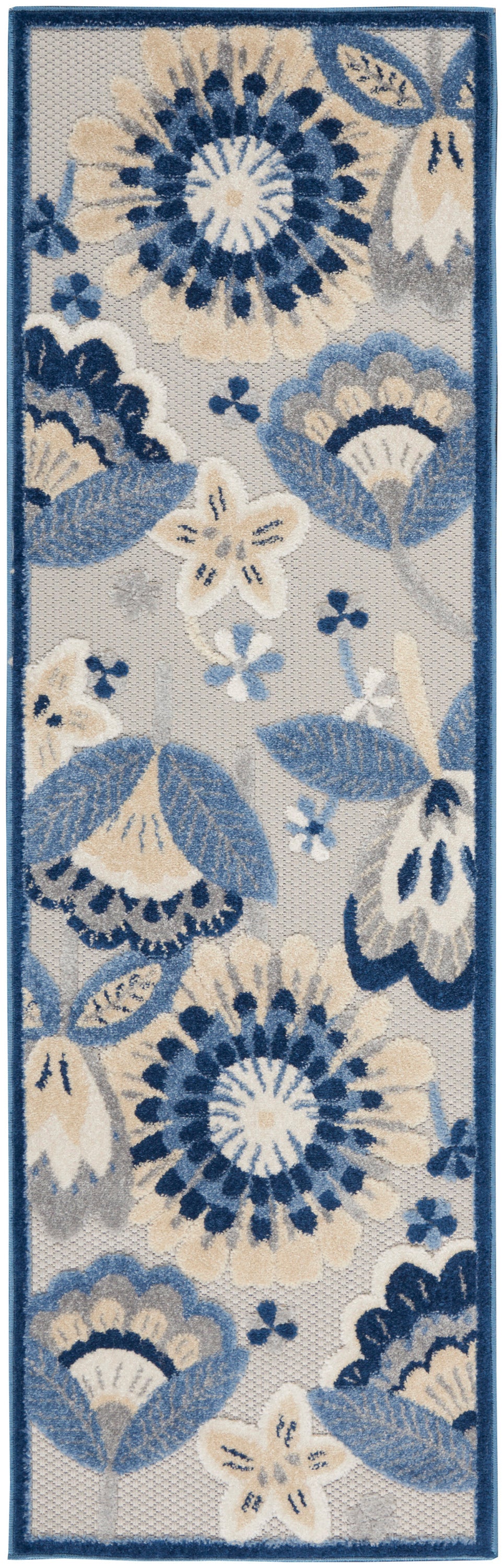 Long rectangular floral runner rug in blue, cream and ivory with a dark blue border and tufted texture.