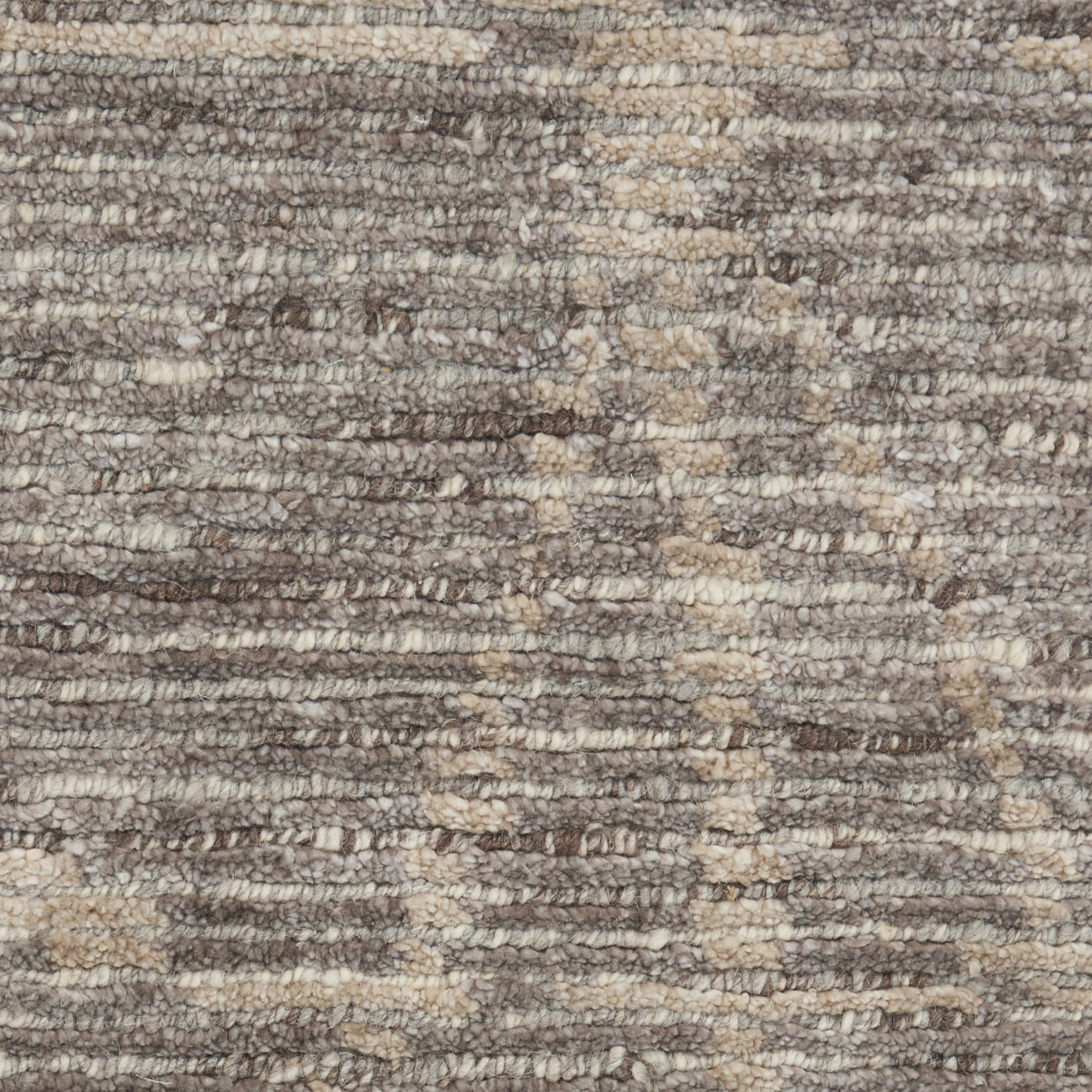 Close-up of a brown and beige textured loop-pile rug.