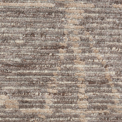 Close-up of a brown and beige textured loop-pile rug.