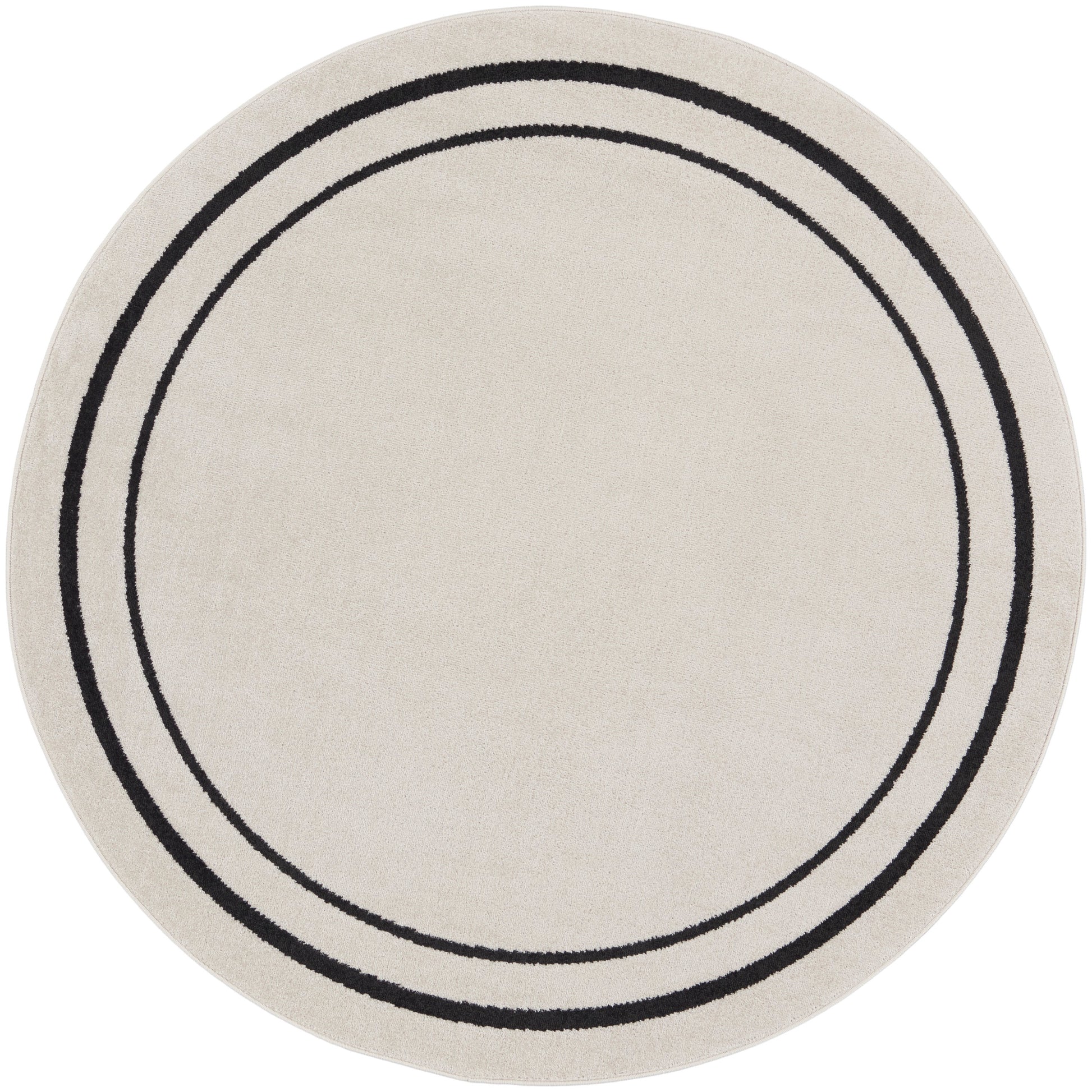 Beige round rug with two black concentric rings; contemporary, soft textured weave.