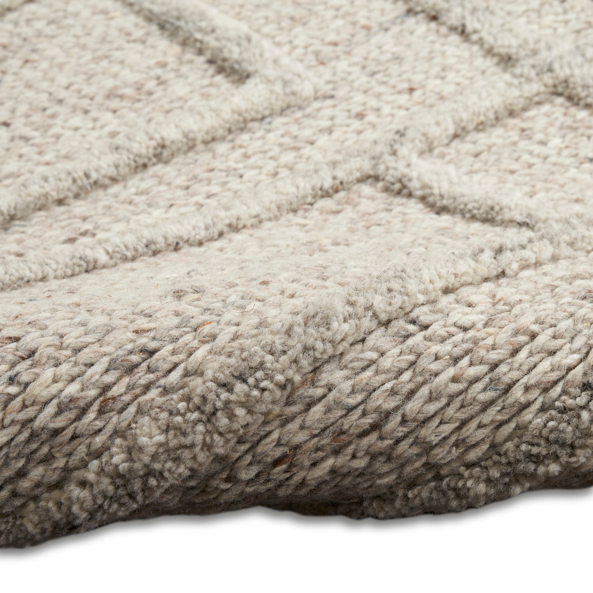 Beige plush shag rug with thick loop pile & subtle geometric pattern; soft, cozy floor rug.